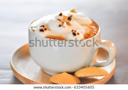 dog shaped milk foam in a cup of coffee,dog foam latte art