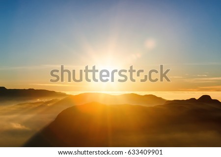 Beautiful landscape. Sunrise on the mountain chain Samanala in the clouds from Sri Pada Adam's Peak. Sri Lanka. Royalty-Free Stock Photo #633409901