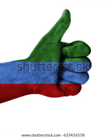 Hand making thumbs up sign.Dagestan painted with flag as symbol of thumbs like,up,okay. Isolated on white background.