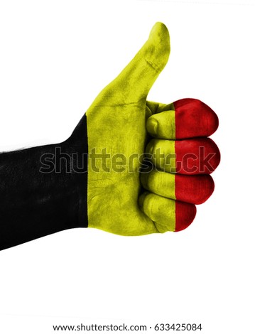Hand making thumbs up sign.Belgium painted with flag as symbol of thumbs like,up,okay. Isolated on white background.