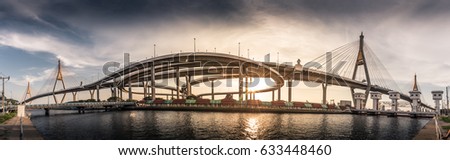 The panoramic photography of the long bridge and the sunlight is backdrop. The panoramic photography of Bhumibol bridge in Bangkok Thailand. 