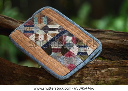 Quilting product. Note book case pattern of quilt. Homemade Japanese quilt. Japanese handcraft. Signed property release. Selective focus and toned image.