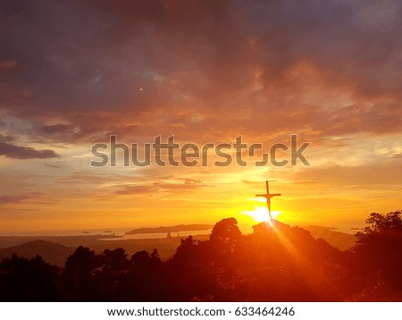 Silhouette of cross during sunset