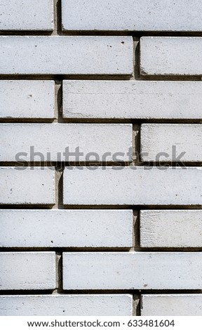 old white brick wall textured background in daylight

