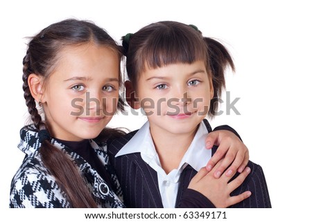 Two sisters have embraced, a white background