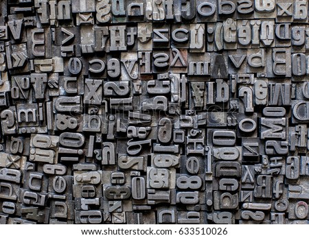 metal letters background Royalty-Free Stock Photo #633510026