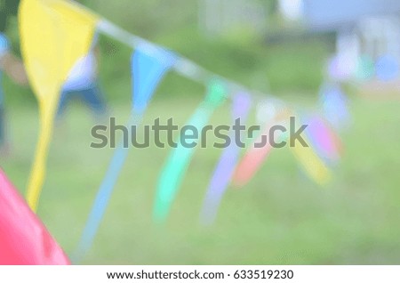 blurred picture colorfull  flag divider at school football field   