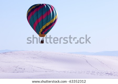 Hot air balloon and white sand dune