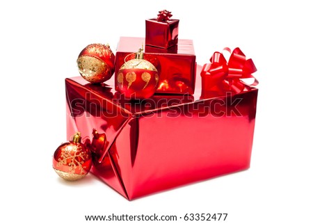 Red present and christmas balls. Isolated on white