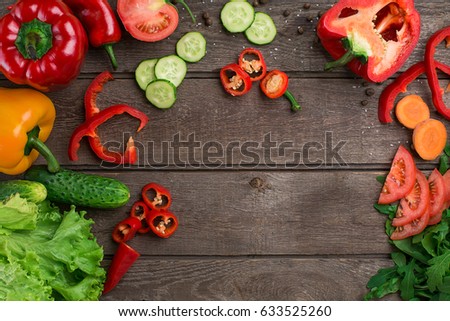 Sport and diet. Sliced Vegetables. Peppers, tomatoes, salad on rustic background