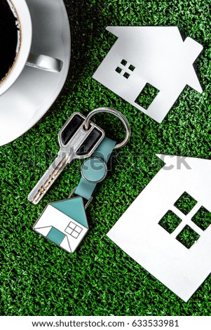 selection of home before buying on green background top view