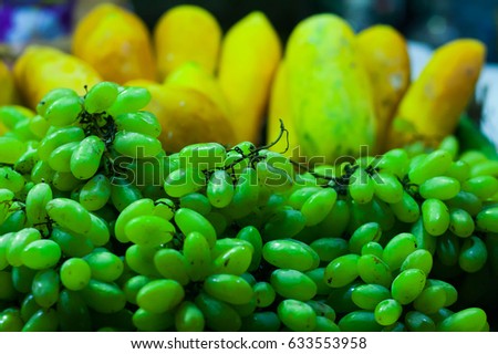 Healthy fruits green grapes background.Grape in a supermarket local market bunch of grapes ready to eat