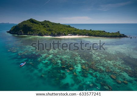 Photo from drone fly over the sea, Islands with shallow water coral at gulf of Thailand. 