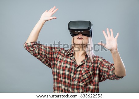 Young cheerful woman with vr headset