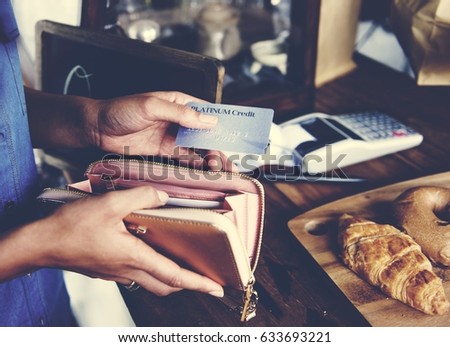 Customer Buying Fresh Baked Bread in Bakery Shop