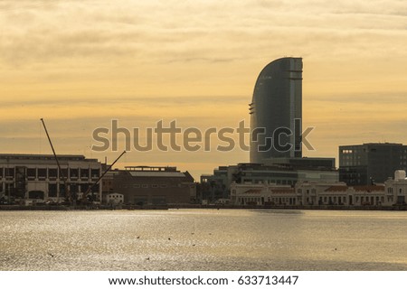 Sunrise at the port of Barcelona, at the end of the Ramblas. In the photo, the sailing hotel. Barcelona, Spain
