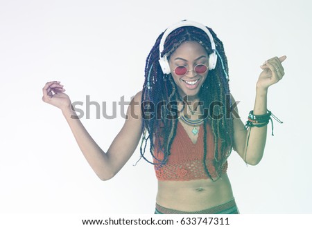 African woman dancing and listening music cheerful