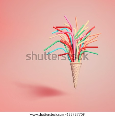 Ice cream cone with colorful drinking straws on bright blue background