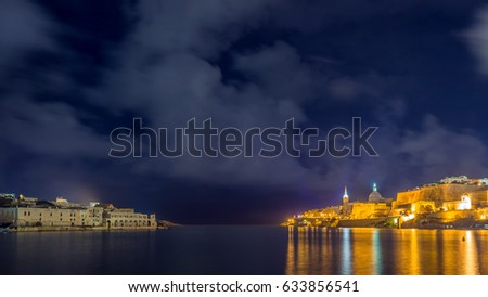 Valletta, Malta - Skyline view of the old city of Valletta and Manoel island with St.Pauls Cathedral taken from Ta'xbiex by night