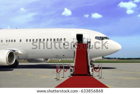 Boarding commercial  airplane with red carpet presentation Royalty-Free Stock Photo #633856868