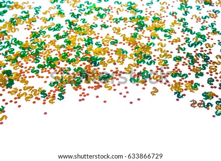 Confetti, glitter dollar sign and coins on white background