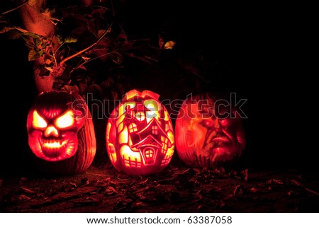 three halloween pumpkin at night