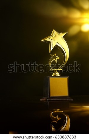 low key of trophy over dark background.