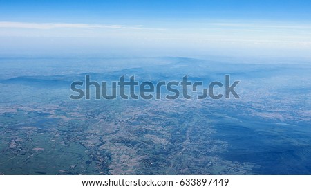 aerial photo from a plane, top view, field roads and city,wide aerial view of agricultural area.