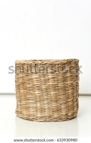 Beautiful wicker basket, handmade on a white background