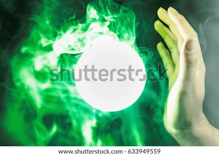 Glass of green light As if being a sorcerer who predicts destiny. Future events And there is smoke coming out of the circle of light. In space In the black scene