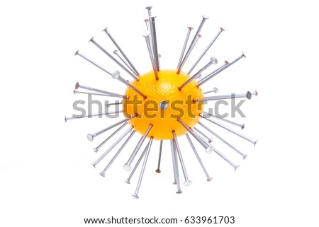 A picture of the orange with the nails in it. It makes no sense, it is just absurdity. Or symbol of acupuncture, something spiky. 