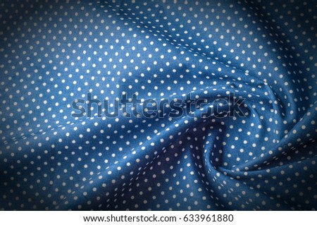 Texture background pattern. Silk fabric, blue cloth in white peas. On a black background. Flower textile or fabric. Texture of fabric. textiles, fabric, material, woven.