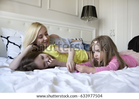 Happy loving family. mother and child girl playing, kissing and hugging