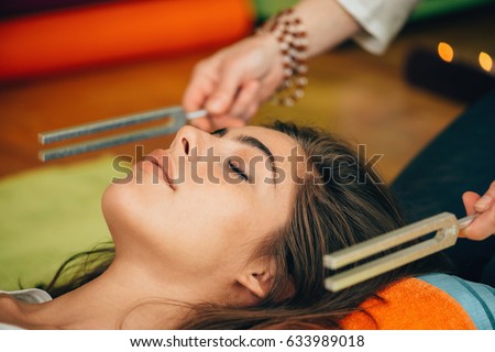 Tuning fork in sound therapy Royalty-Free Stock Photo #633989018