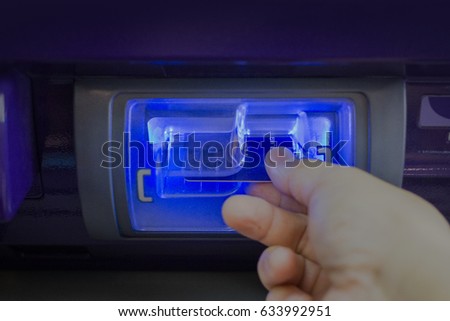 The hand pull out ATM card from Automatic Teller Machine Royalty-Free Stock Photo #633992951