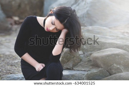 Sad Girl in Pain Outdoor. Migraine and Anxiety Concept Royalty-Free Stock Photo #634001525