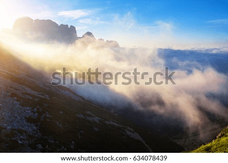 foggy summer morning in the Dolomite mountains, Italy, beautiful natural background