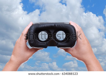 Technology, gaming, entertainment or 3d glasses.VR headset glasses and background sky and clouds.Concept technology and imagination.
