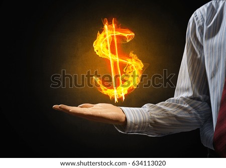 Close of businessman hand showing in palm glowing dollar sign
