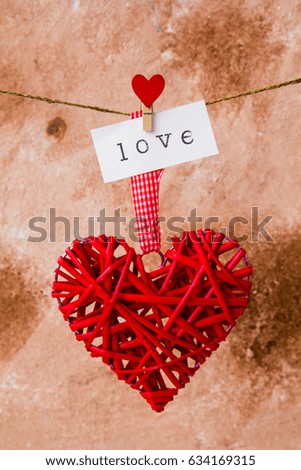 Heart and inscription love hang on the rope