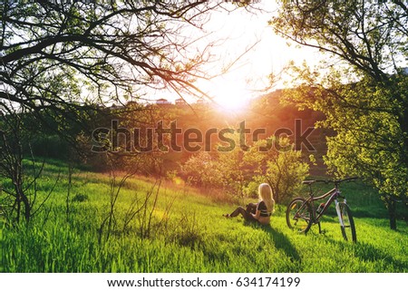Girl cyclist in nature