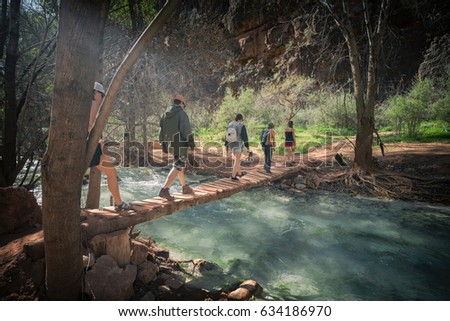 Friends hiking to an amazing destination, Grand Canyon, Arizona Royalty-Free Stock Photo #634186970