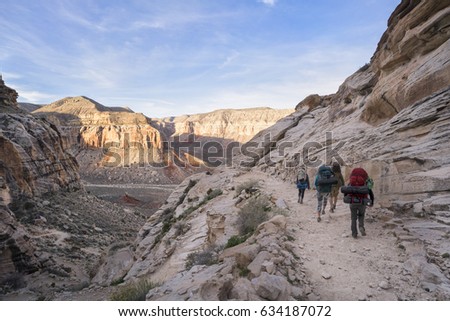 Group of Hikers backpacking through the Grand Canyon to Havasu Falls, Arizona Royalty-Free Stock Photo #634187072