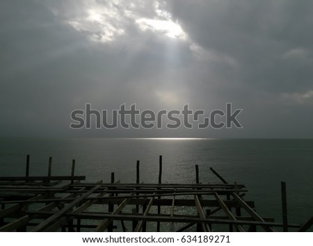 Background Black sky with light shining into the sea