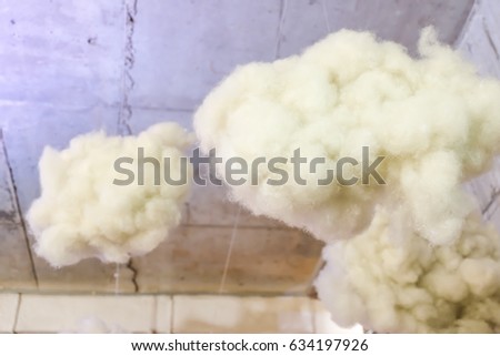 Cotton artificial clouds under the ceiling in interior