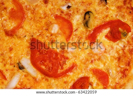 Closeup picture of pizza with tomatoes