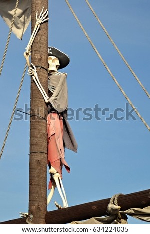 Pirate skeleton hanging on mast