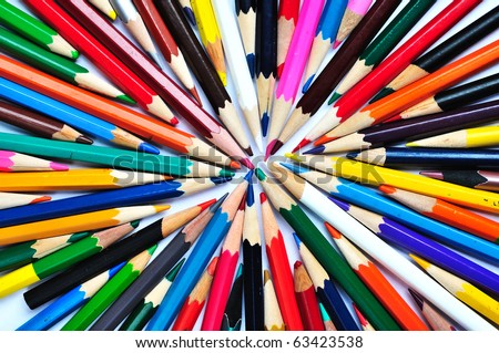 a lot of color pencils on a white background