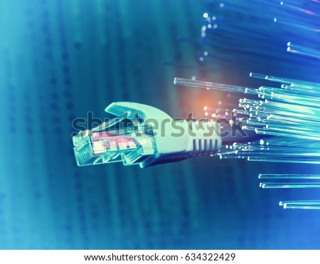 network cables closeup with fiber optical background Royalty-Free Stock Photo #634322429