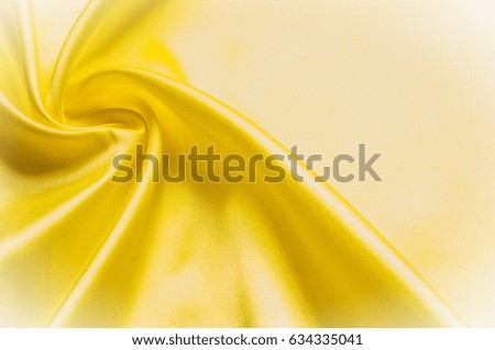 Texture background pattern. Silk fabric, yellow fabric. On a black background. Flower textile or fabric. Texture of fabric.  textiles, material, woven.